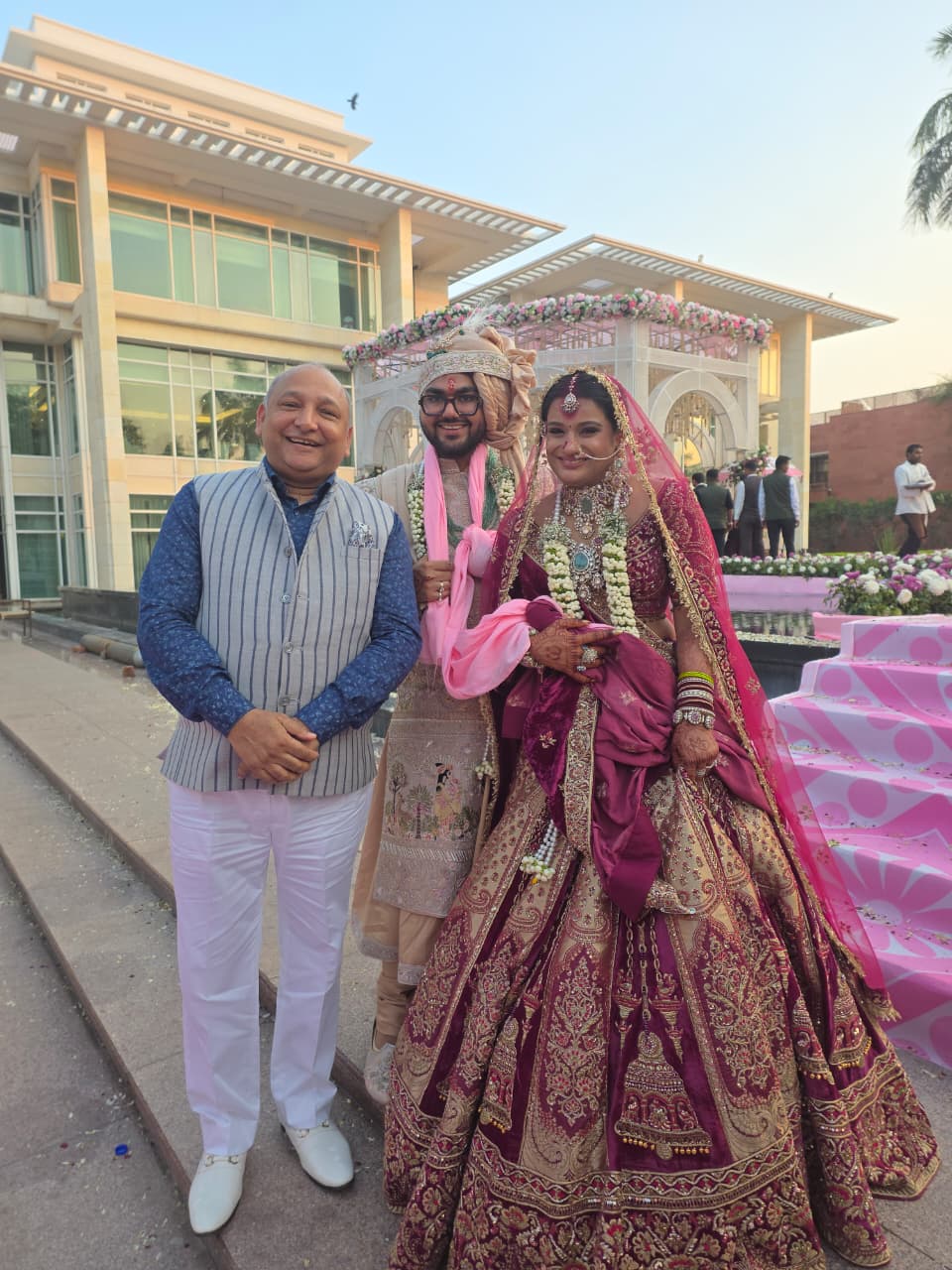 Mr. Manoj Garg with the bride and groom outside the venue