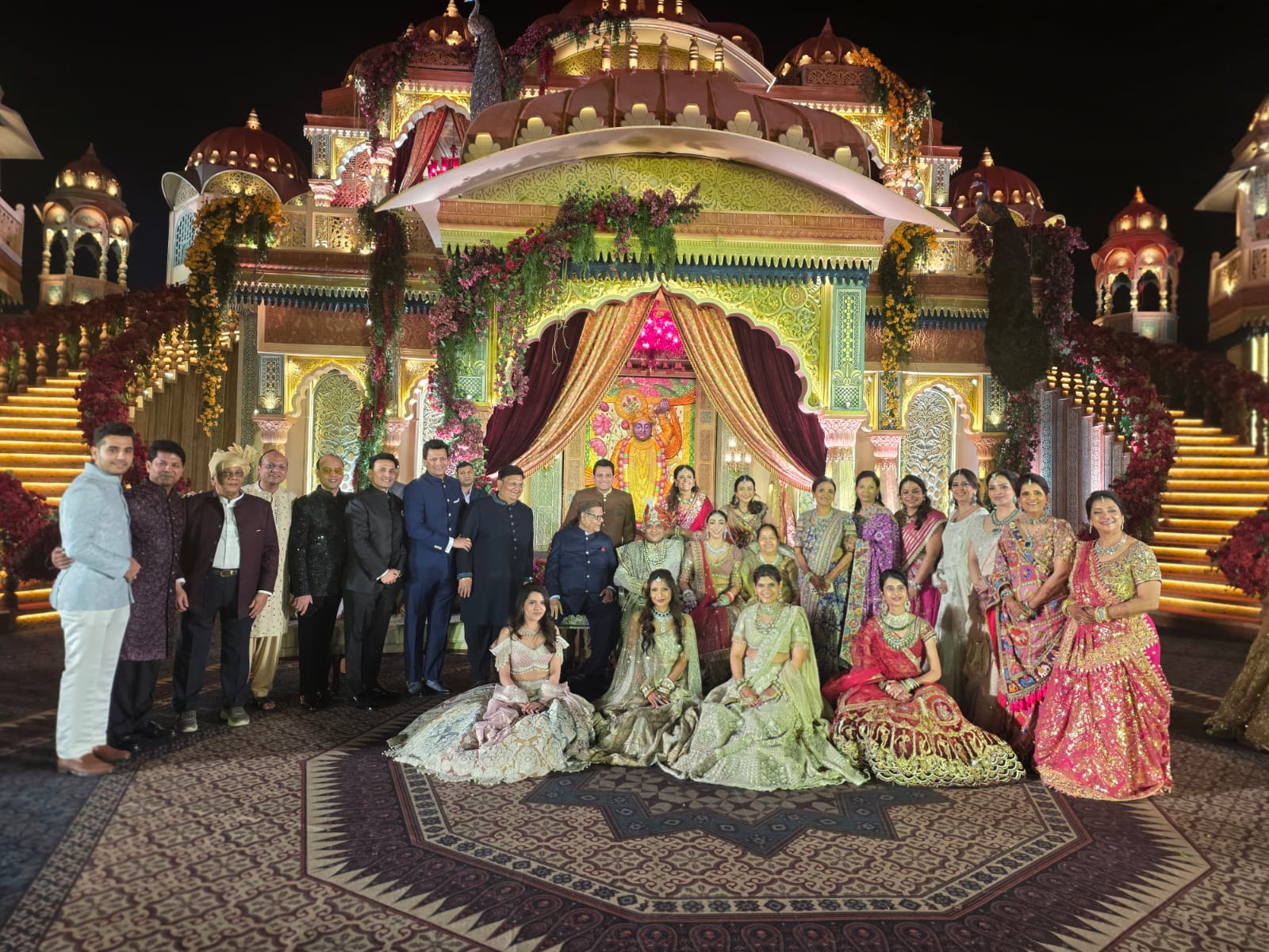 Family portrait at a grand wedding mandap
