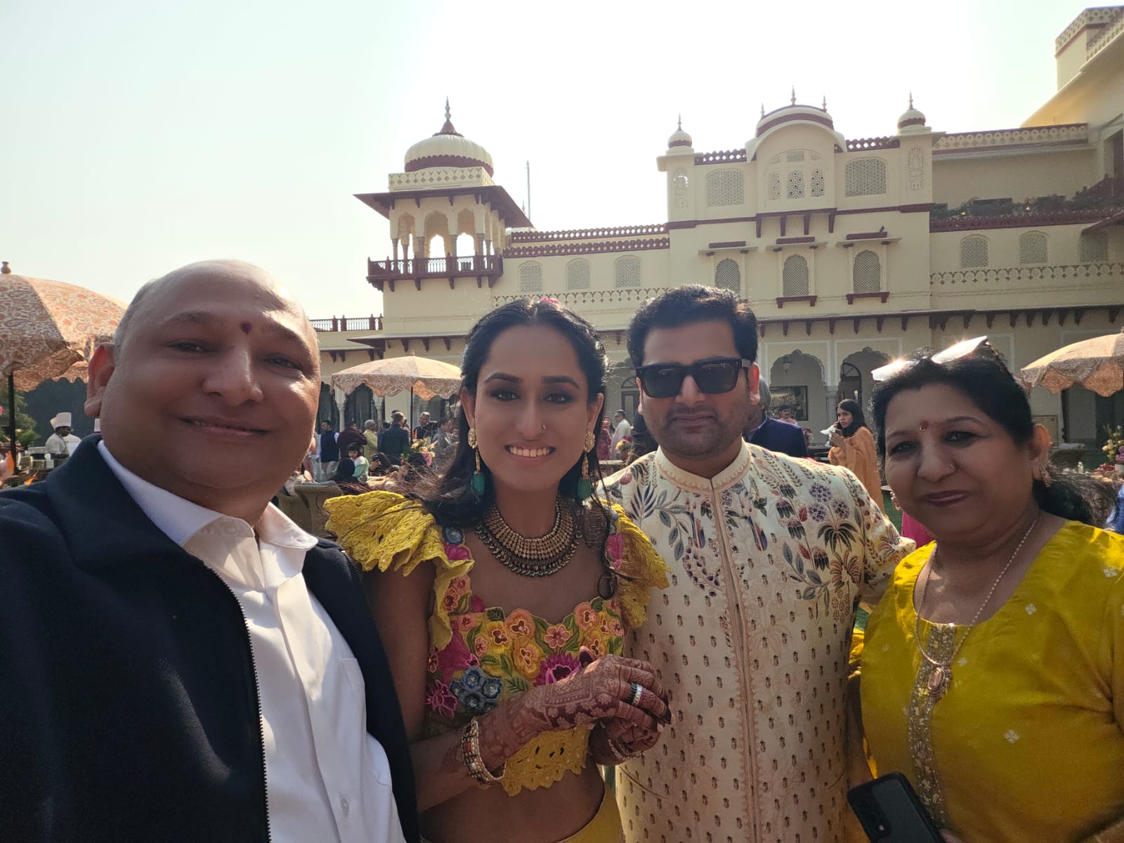 Bride and groom with family and Mr. Manoj Garg